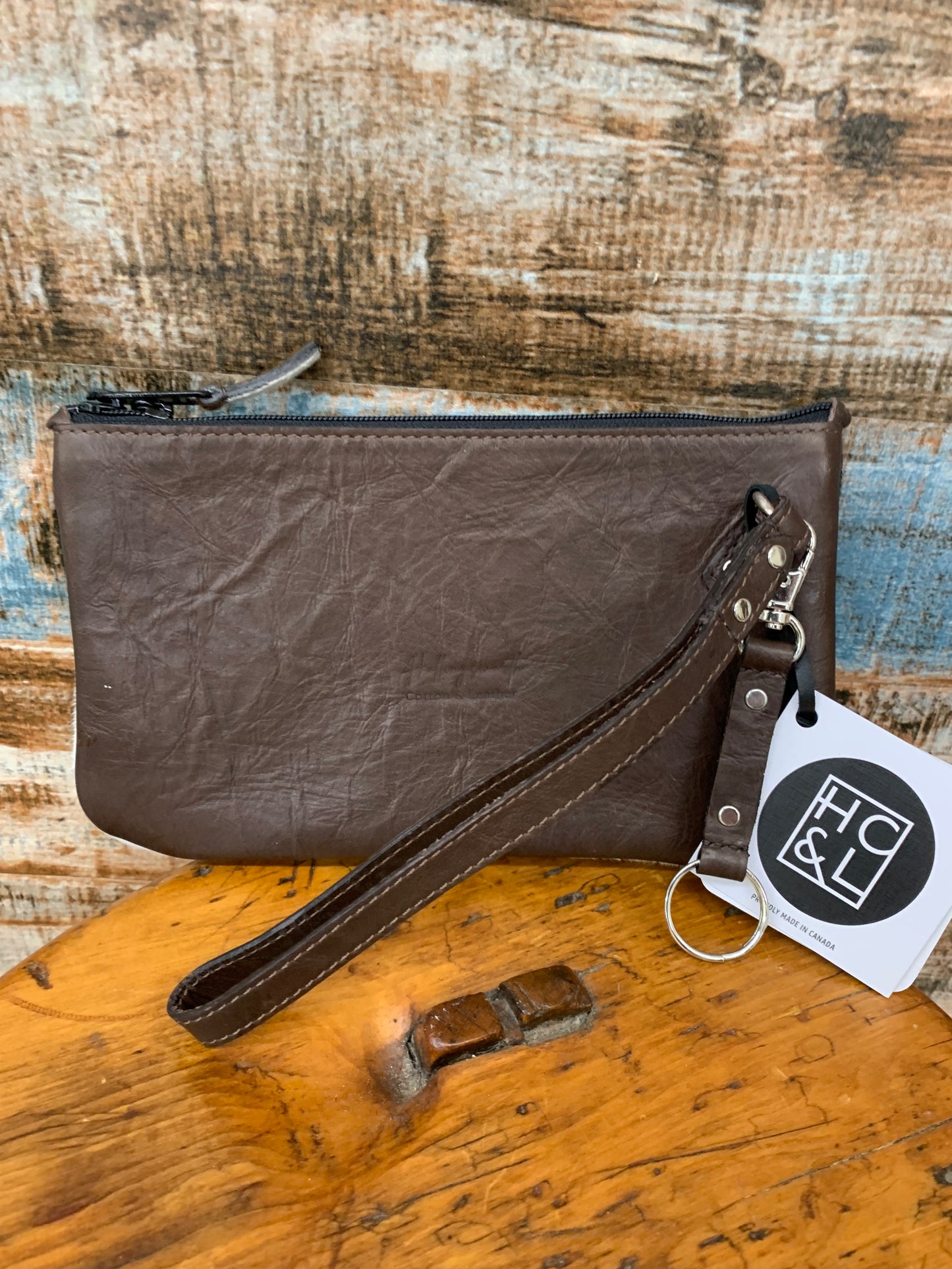 HCL handcrafted leather and hide hand clutch with keychain